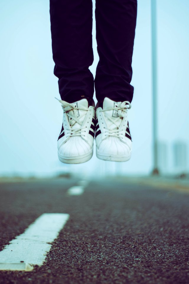 Person In Adidas Sneakers