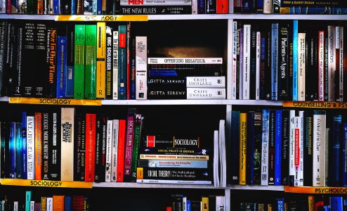 Photography Of Books On Bookshelf photo