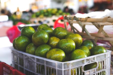 Crate Of Round Green Fruits