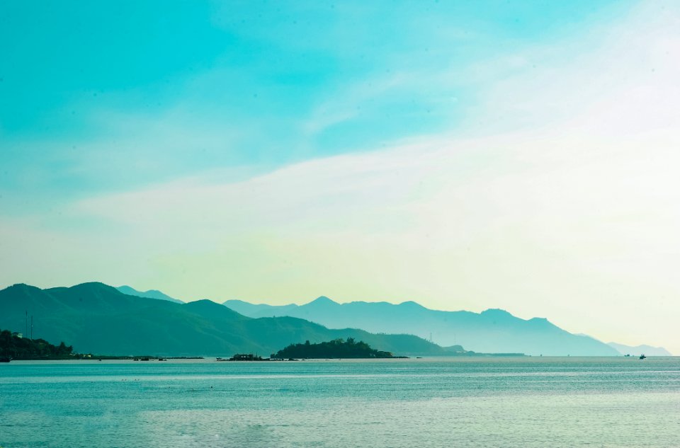 Landscape Photo Of Mountain Over Body Of Water