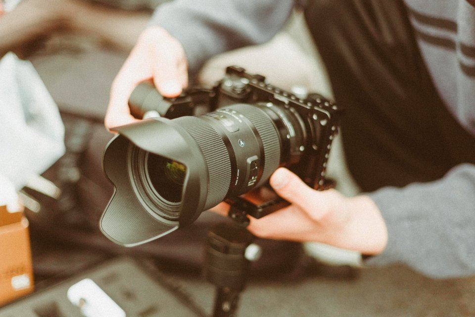 Black And Gray Dslr Camera With Stability Lens