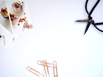 Flat Lay Photography Of Paper Clips And Scissor photo