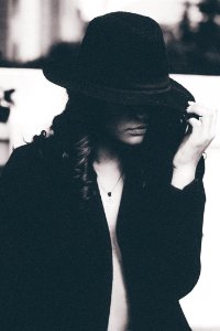 Grayscale Photo Of Woman With Hat And Coat photo