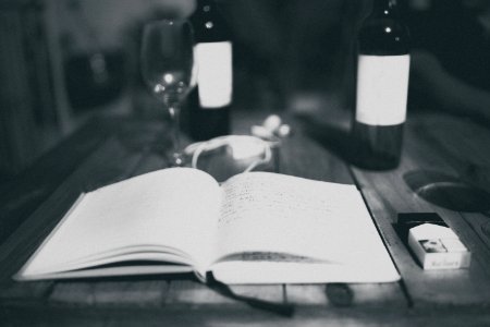 White Book On Gray Wooden Table Surface