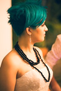 Tilt Shift Lens Photography Of Woman Wearing Beaded Black Necklace photo