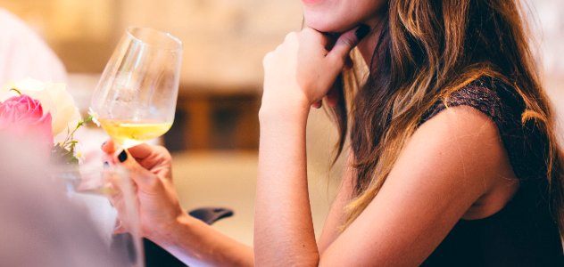 Woman Holding Wine Glass photo