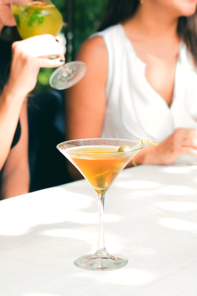Clear Cocktail Glass Filled With Liquor On White Table