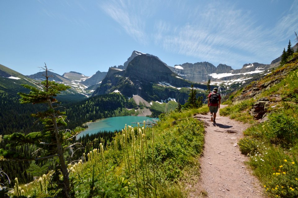 Man Walking On Road While On Mountain