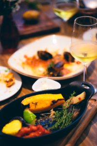 Sizzling Plate Filled By Sliced Fruit And Herb