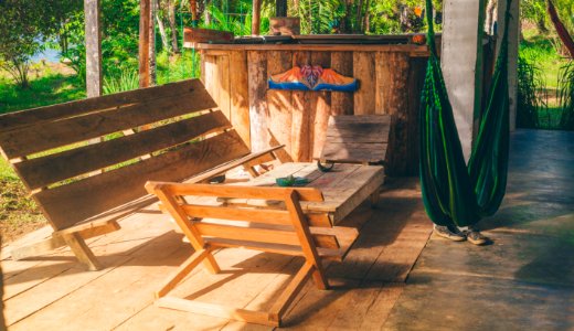 Green Hammock Near Wooden Patio Set photo