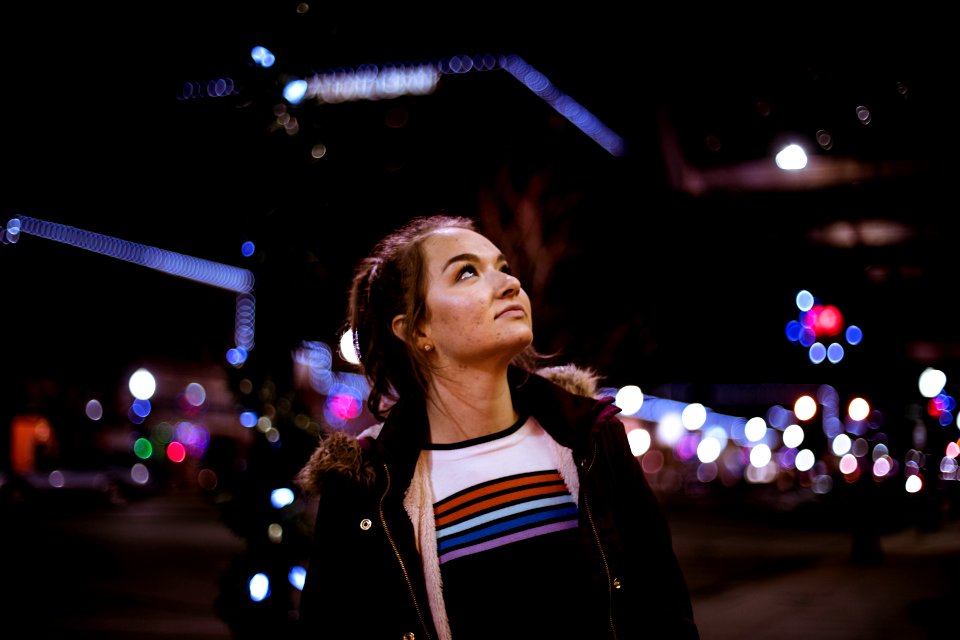 Woman Looking Up During Night Time