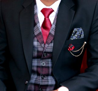 Man Wearing Black Notched Lapel Suit Jacket photo