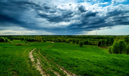 Gray Clouds Under Green Field photo