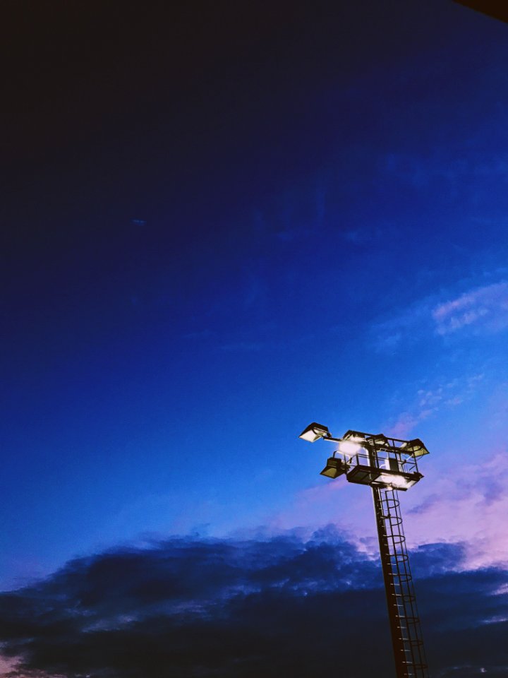 Light Tower Under Blue Cloudy Skies