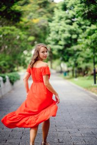 Woman Wearing Orange Off-shoulder Dress photo