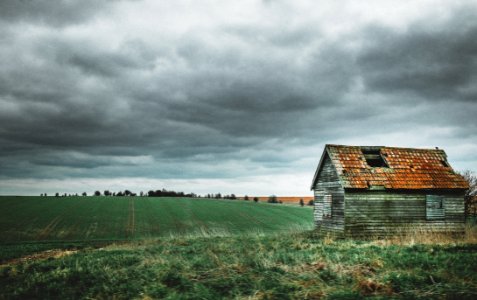 Grey And Brown House Near Green Grass Field