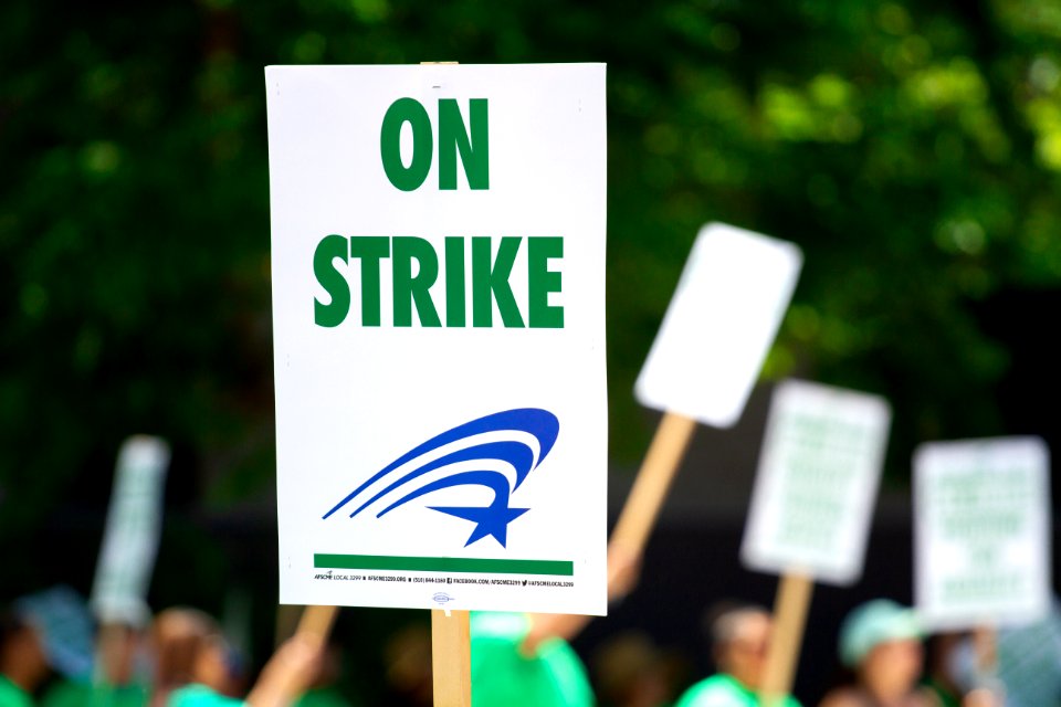 People Rallying Carrying On Strike Signage