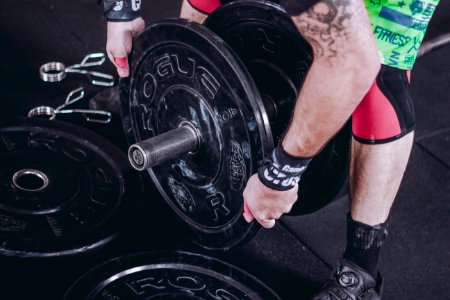 Person Holding Barbell photo