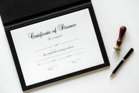 Certificate Of Divorce Paper Beside Black Ballpoint Pen photo
