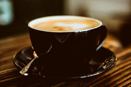 Black Ceramic Cup Filled With Latte