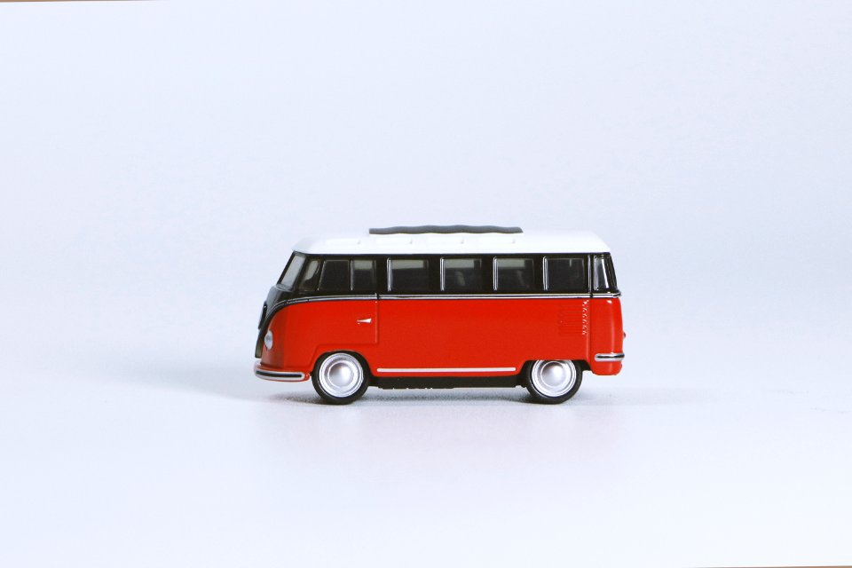 Red Volkswagen T1 Die-cast Toy On White Surface