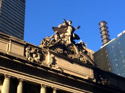 Person Standing Raising Two Hands Statue