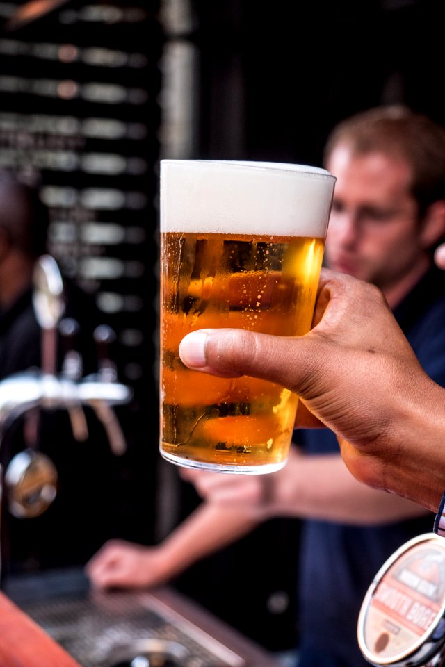 Person Holding Glass Filled With Liqour