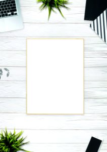 Photo Of Brown Photo Frame Near Laptop