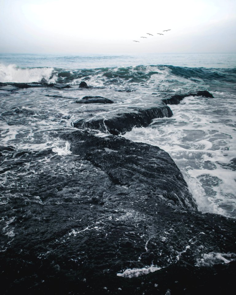 Landscape Photography Of Body Of Water Smashing In The Rocks
