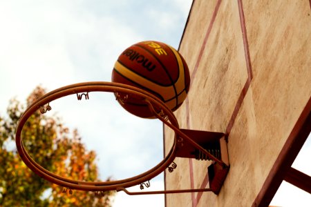 Brown Basketball Above Steel Basketball Hoop photo