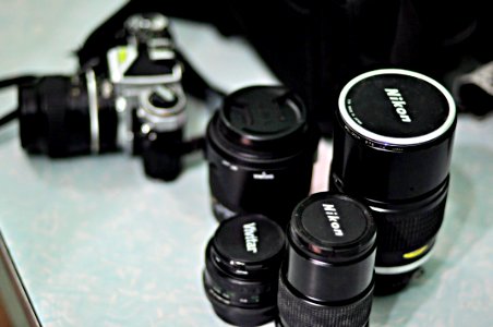 Four Black Nikon Zoom Camera Lens photo