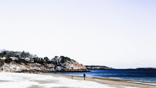 Person Walking On Seashore