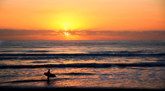 Photo Of Surfer In Rule Of Thirds Photography During Sunset photo