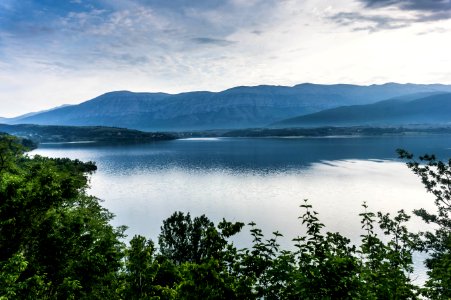 View Of Body Of Water And Mountains photo