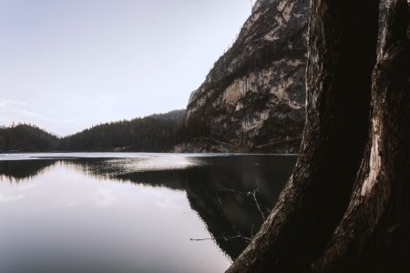 Landscape Photography Of Lake Beside Cliff At Daytime photo