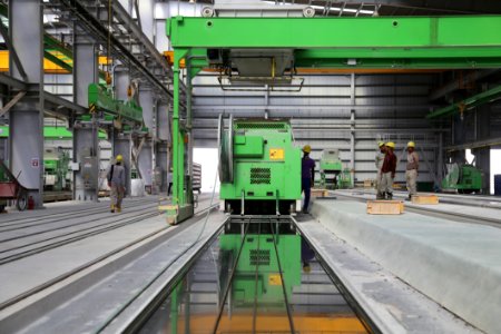 People Stands Near Green Metal Industrial Machine photo