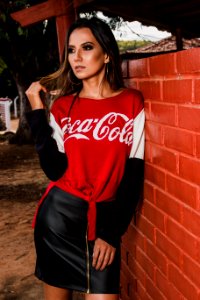 Woman Wearing Black White And Red Coca-cola Long-sleeved Shirt And Mini Skirt photo