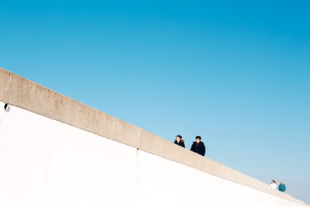 Four Person Wearing Jacket Under White Cloud Blue Skies photo