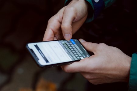 Person Holding Iphone X photo