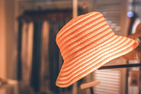 Selective Focus Photography Of Orange Hat