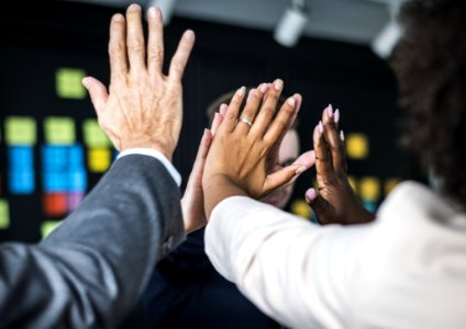 People Doing A High Five photo