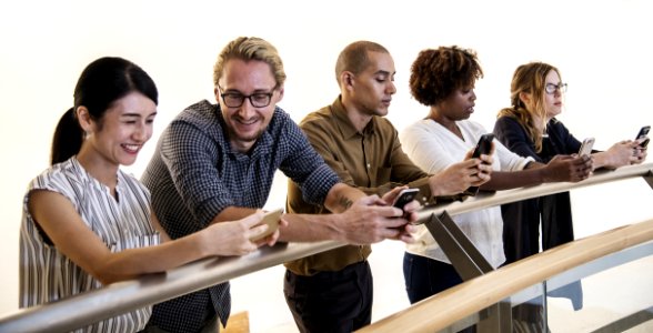 Five Person Holding Mobile Phones photo