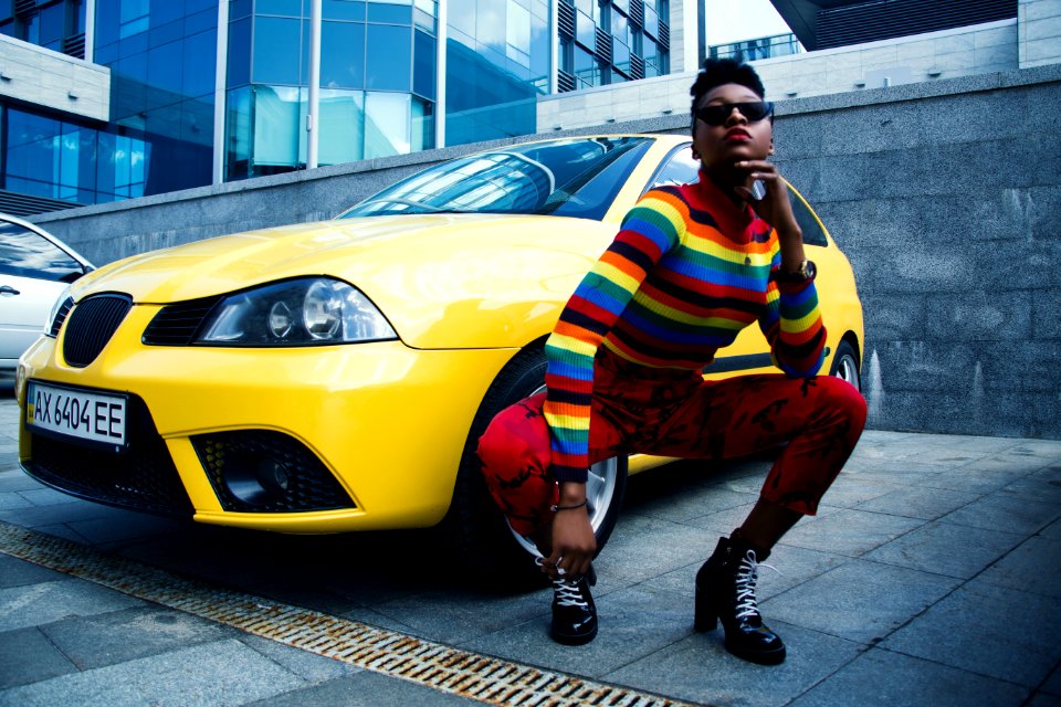 Woman Wearing Red Leggings Beside Yellow Car