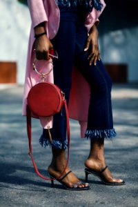 Woman Holding Round Leather 2-way Handbag photo