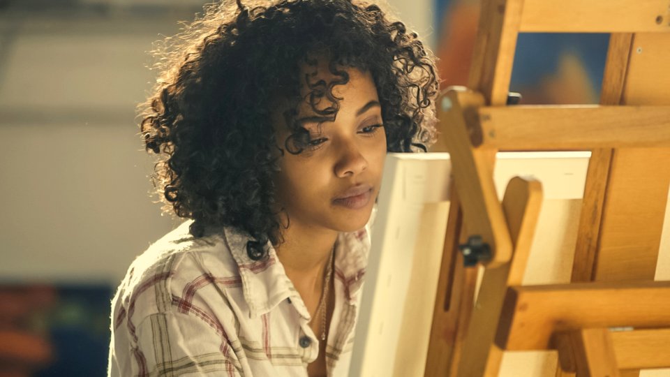 Woman Wearing White Collared Shirt Standing Near Brown Easel
