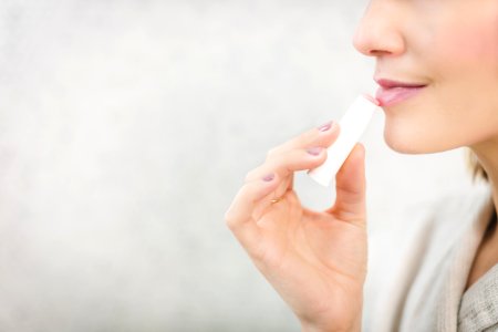 Woman About To Apply Pink Lip Balm