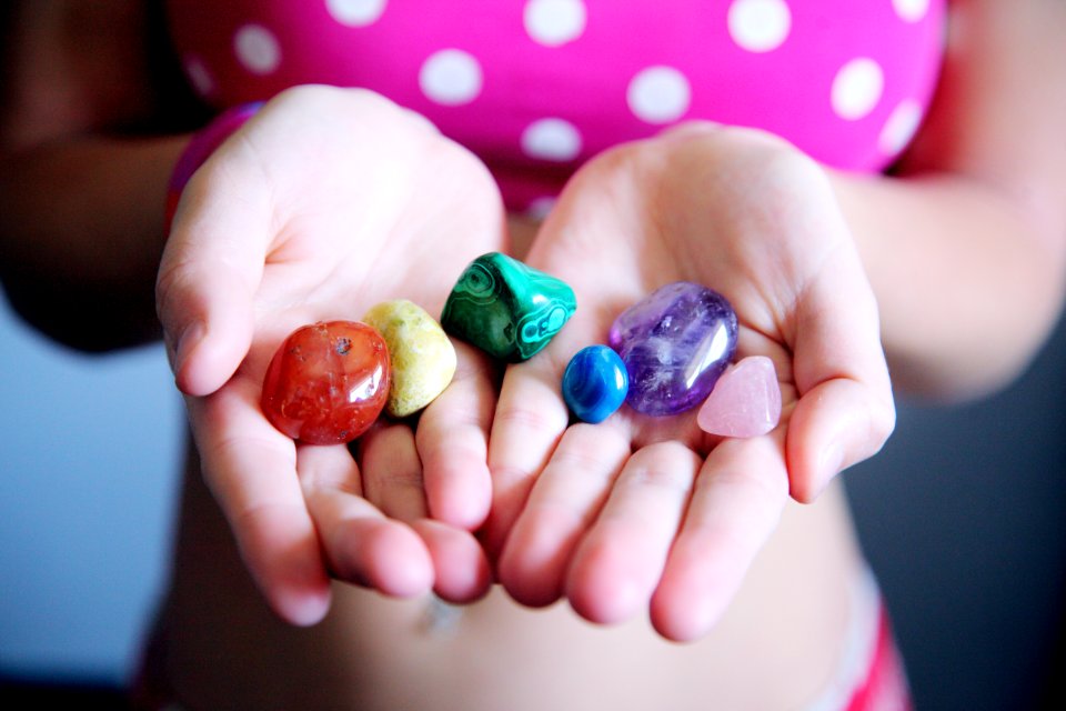 Woman Holding Six Polished Stones