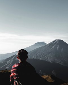 Photo Of Person Atop Mountains