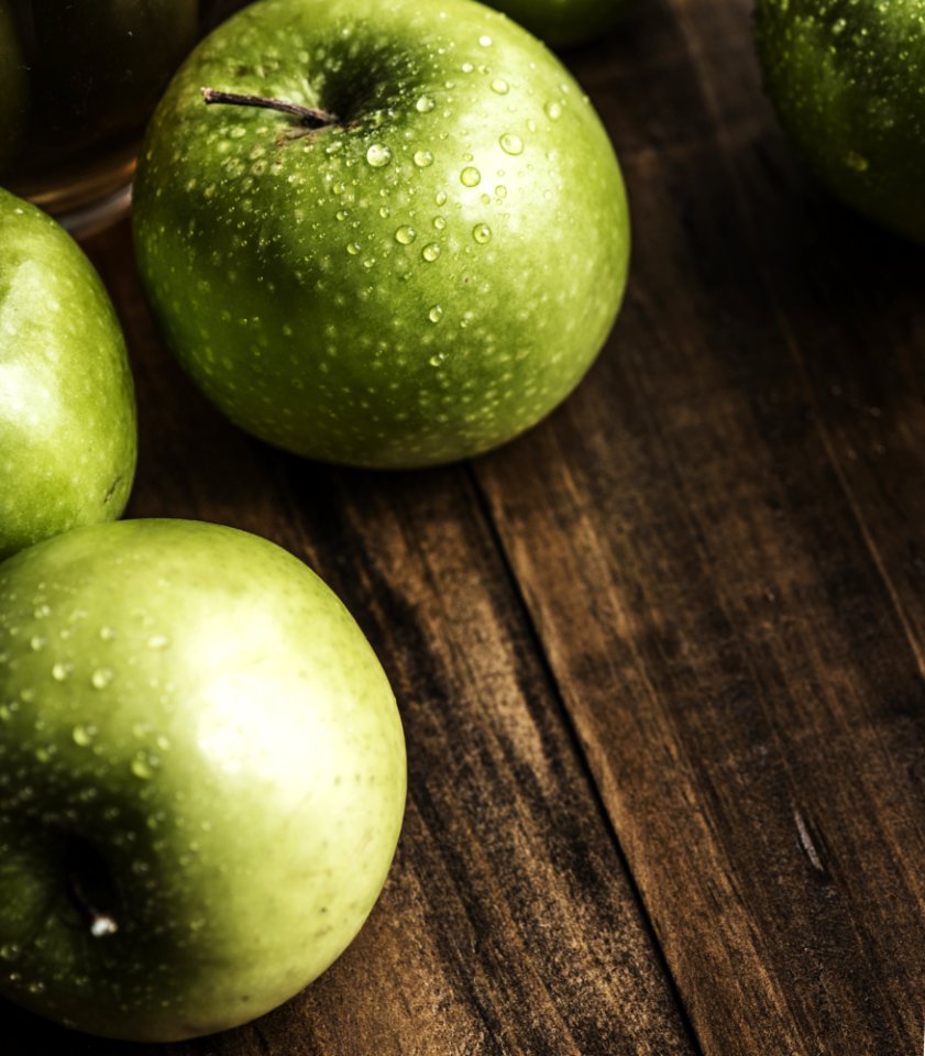 Green Apples On Brown Surface
