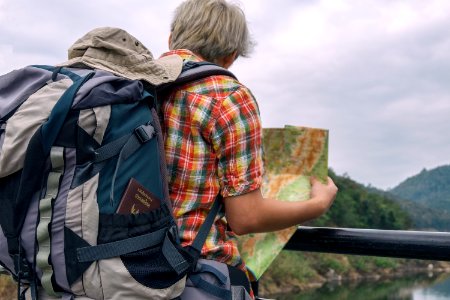 Man Holding Green And Brown Map photo